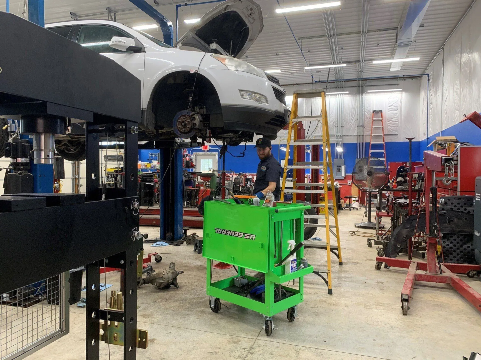 Technician performing transmission service at Tim Worthy's shop in Wellsville, KS